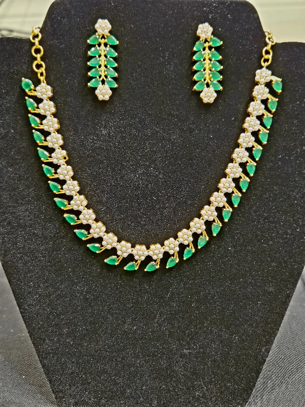 Crystal Bead Necklace-Stunning  Emerald Stone Studded Leaf Shaped Gold Plated Necklace Set With Pearls And Earring.