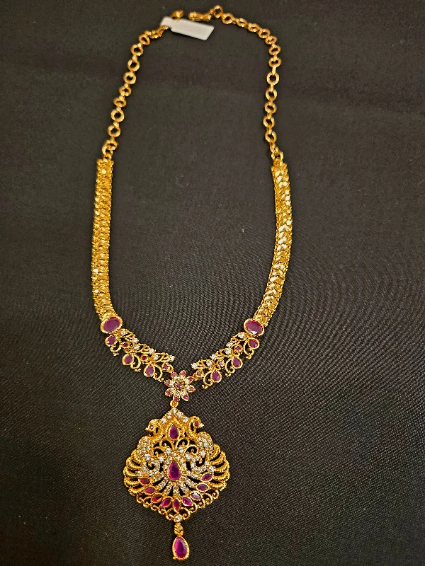 Diamond Pendant Necklace-Dazzling Gold Plated Peacock Design With Ruby And White Stone Chain For Women